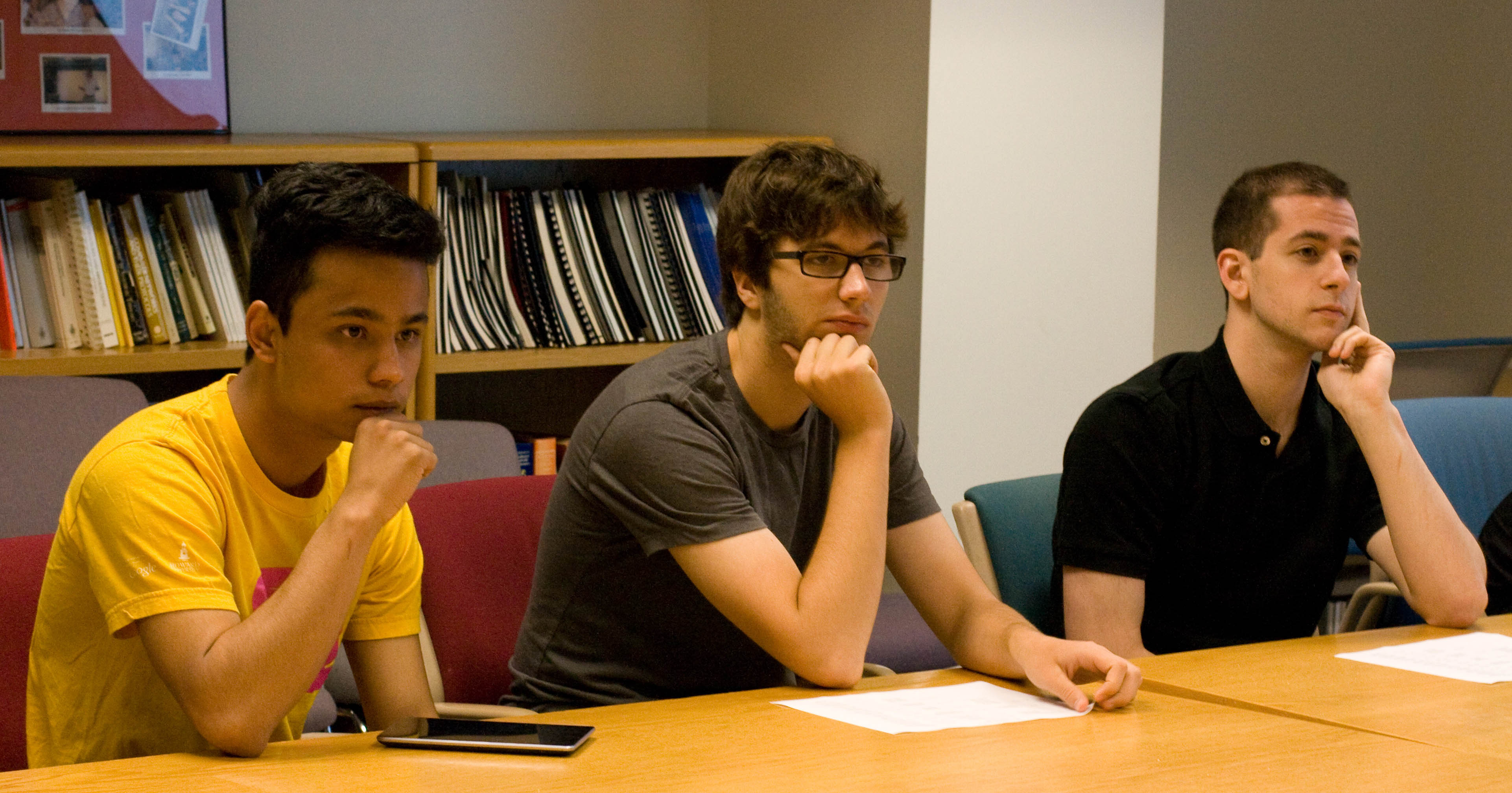 REU students Roshan
      Thapaliya (left), Jacob McNamara (center), and Leo Behe (right).